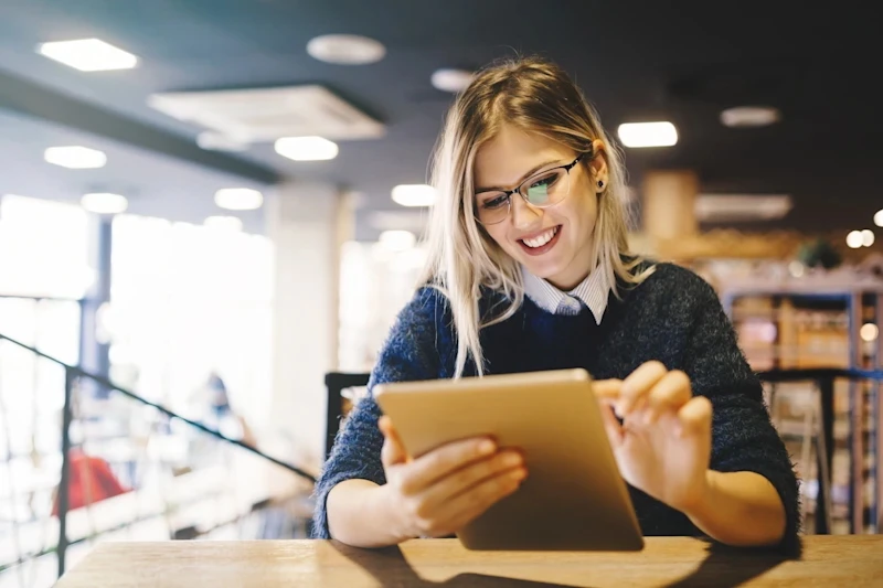 Female student holding a tablet
