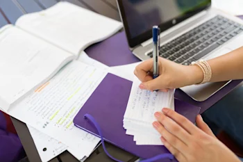 student-studying-with-laptop-and-index-cards