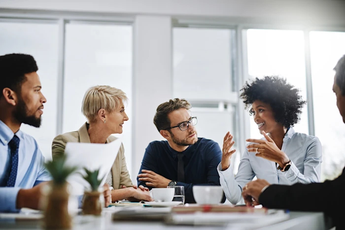 A group of colleagues sitting in a conference room