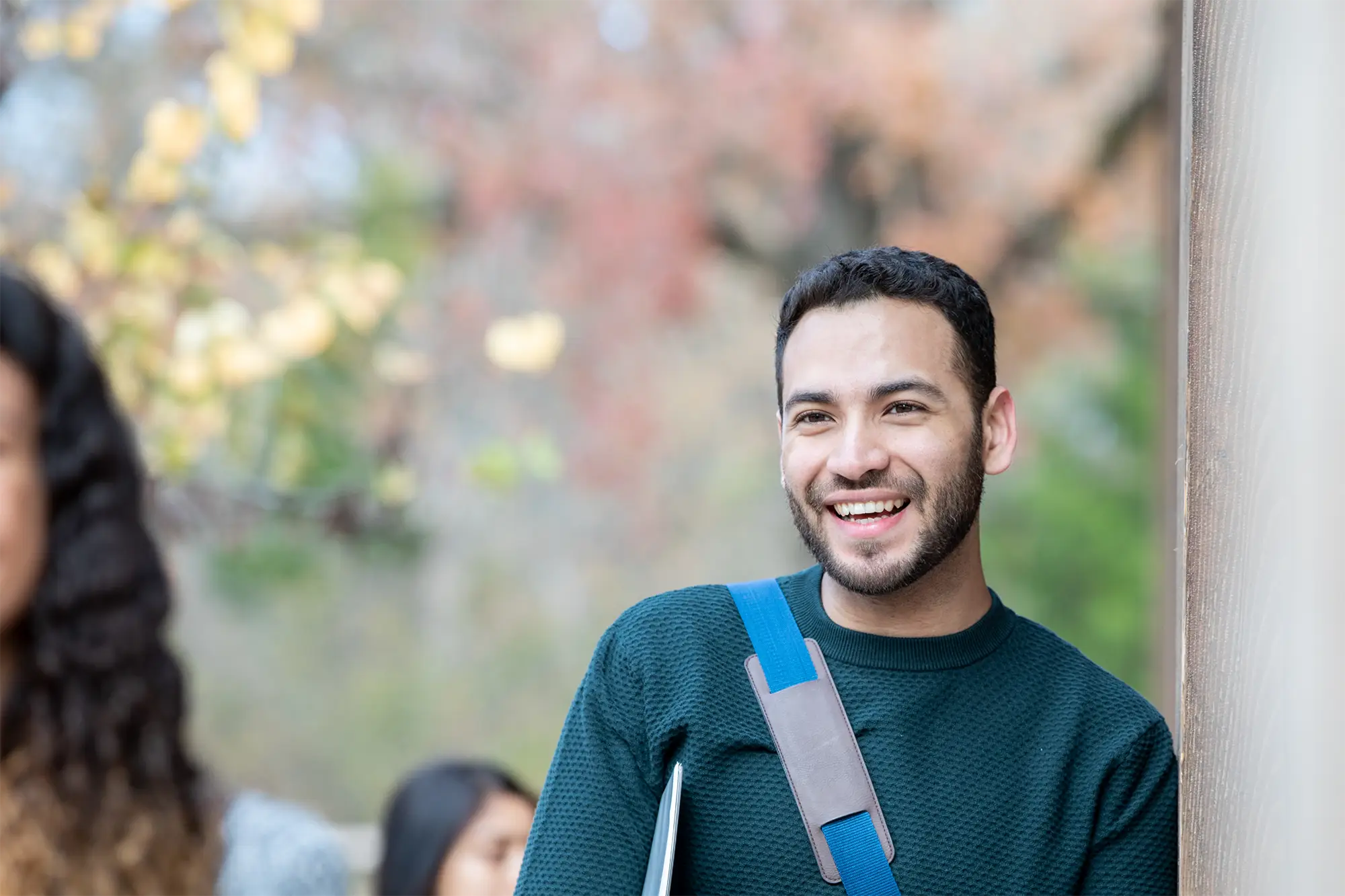 Smiling university student outdoors on campus