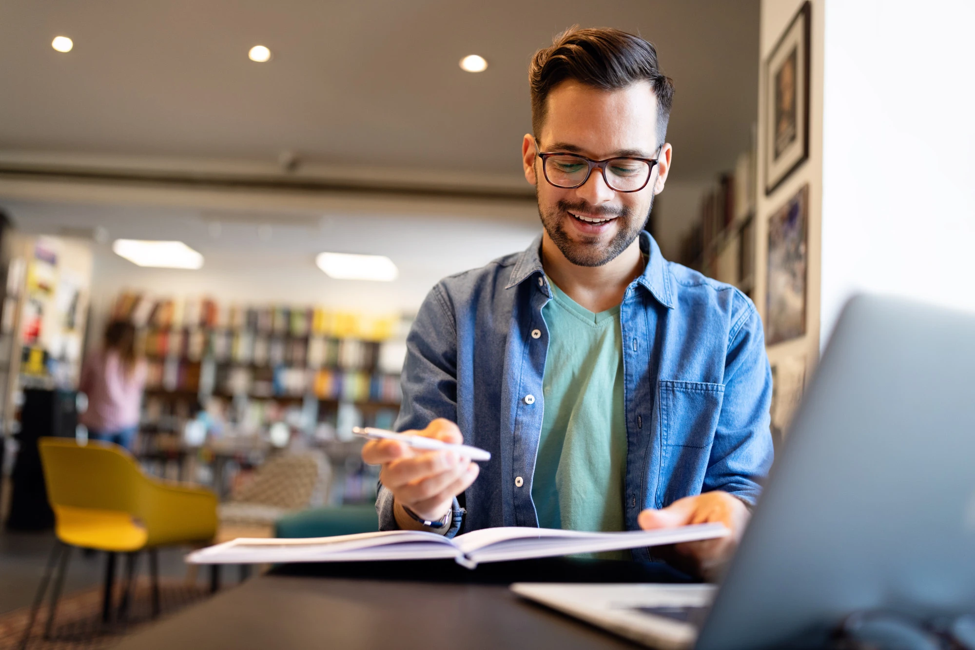 Man sitting at a desk with a notebook