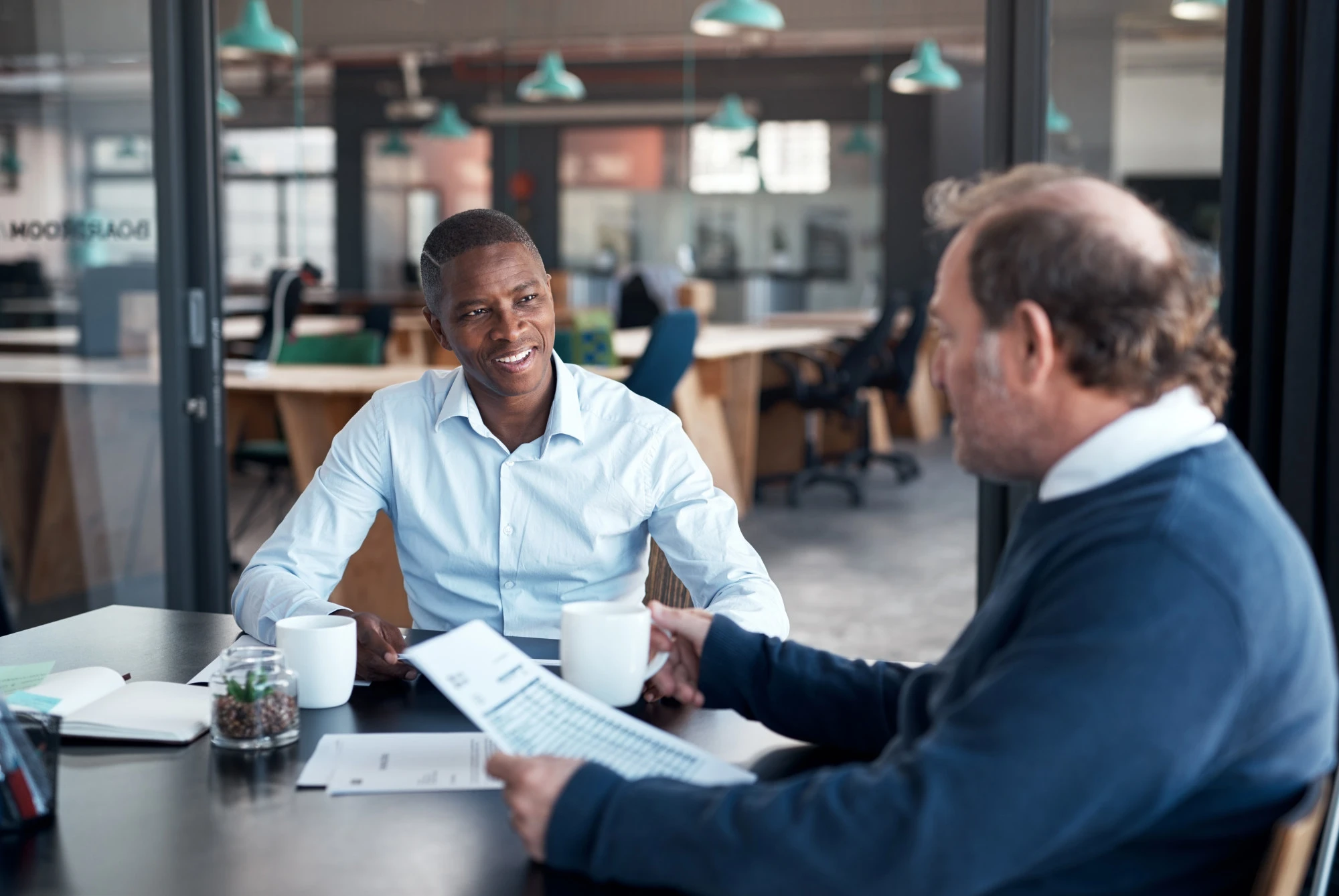 Insurance agent sitting with a client