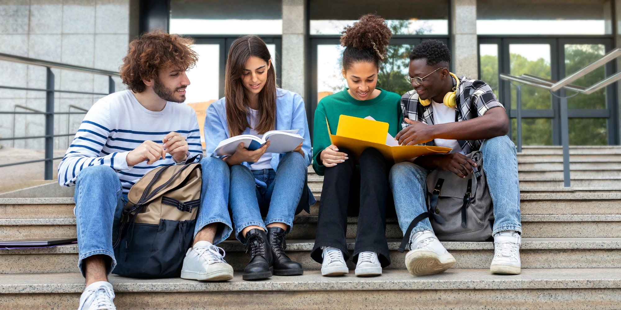Study group sitting outside on school steps.