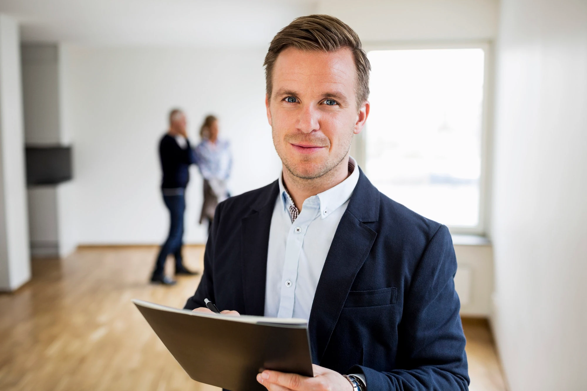 Real estate agent with clients