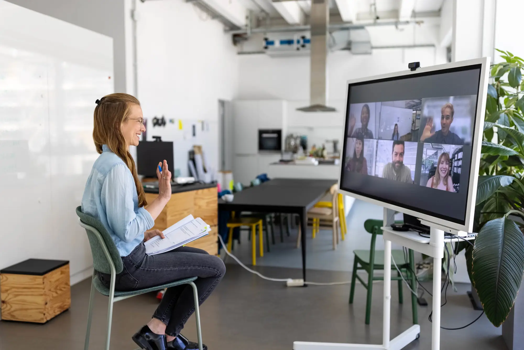 woman in a virtual meeting with colleagues