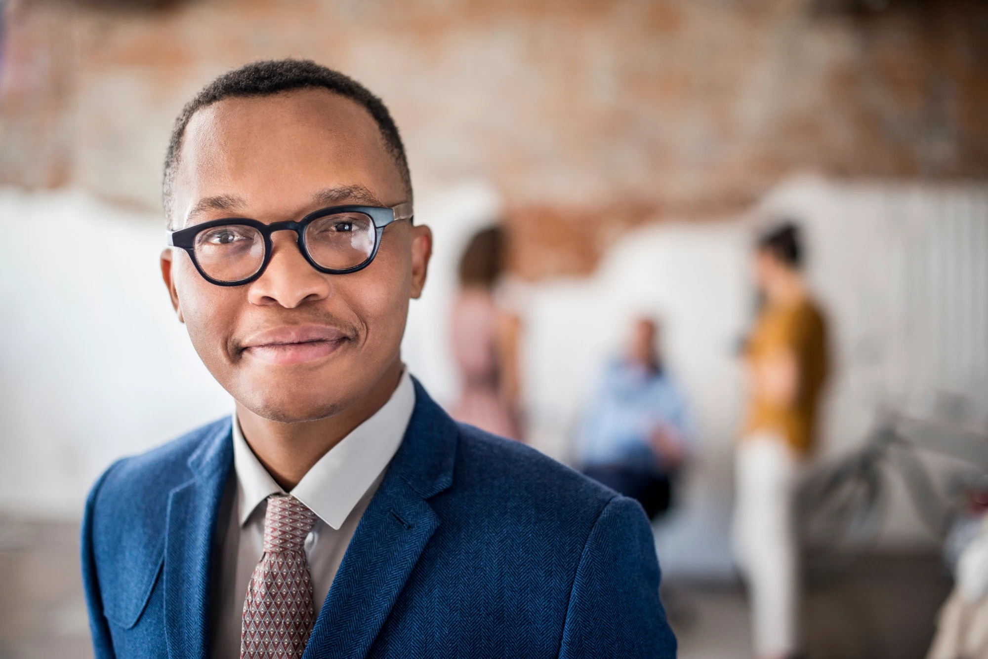 Businessman with glasses in a work setting