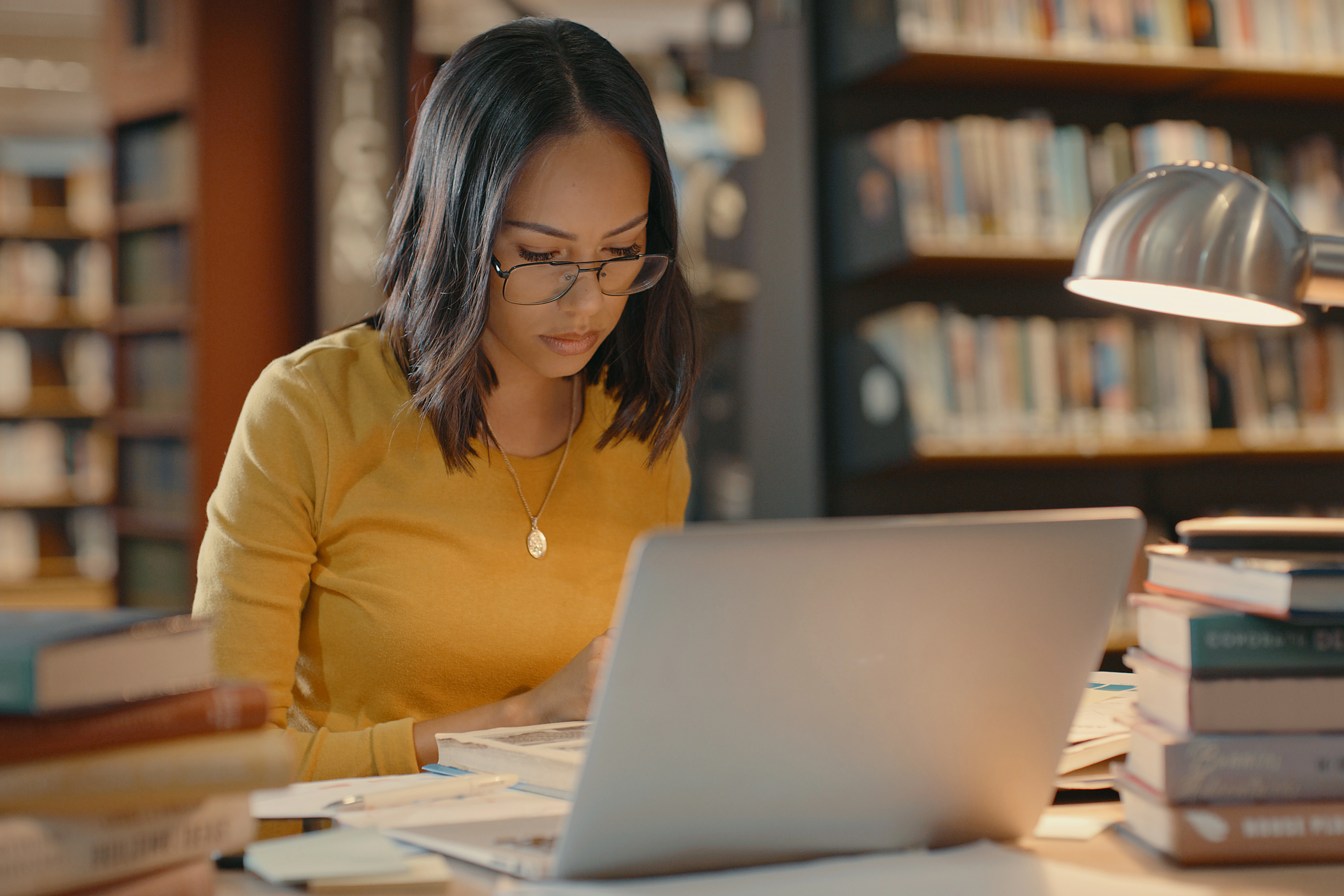 University of Texas - Austin student studying in library