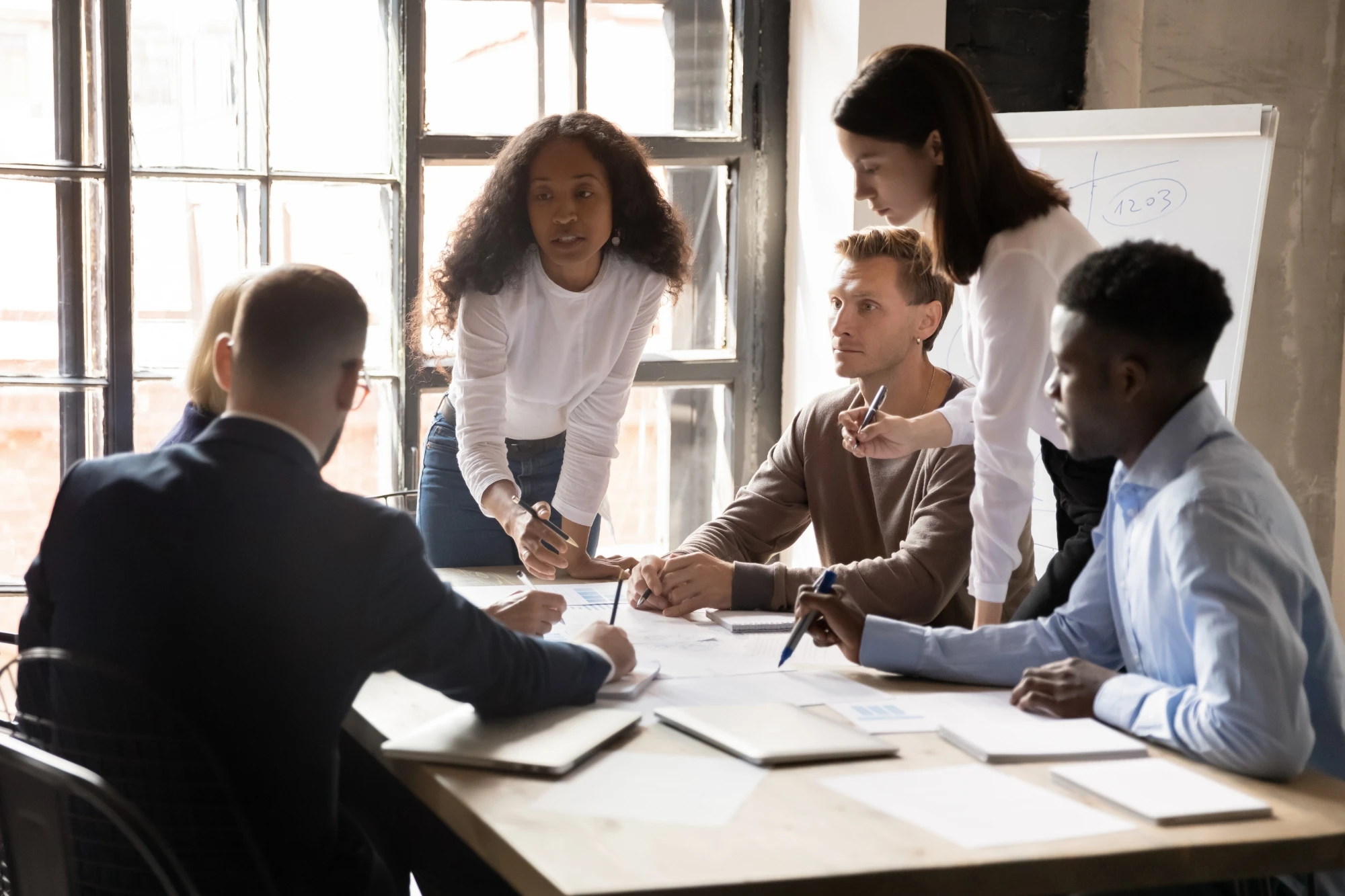 several people having a discussion around table