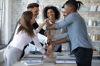 bigstock-Smiling-Diverse-Employees-Stac-359634859.JPG