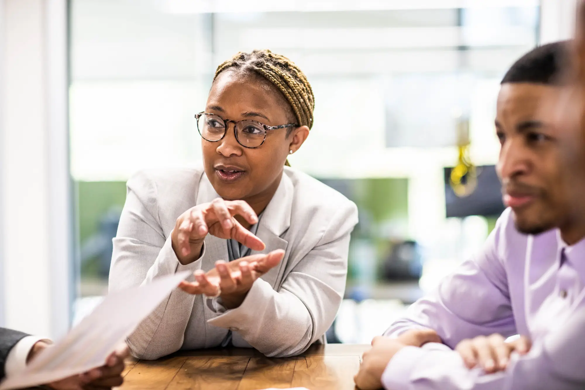 woman with glasses discussion in business meeting