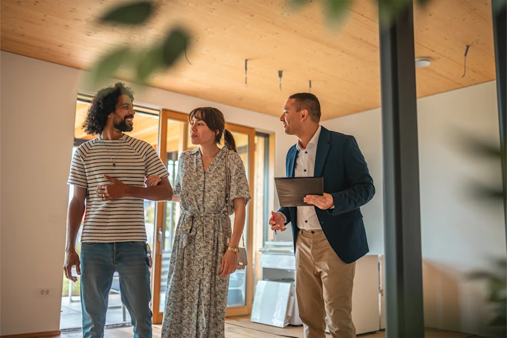 dearborn - man showing couple house opening