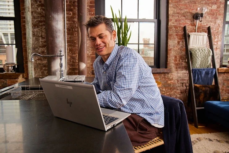 Work With Us - Career Areas - man on laptop at home