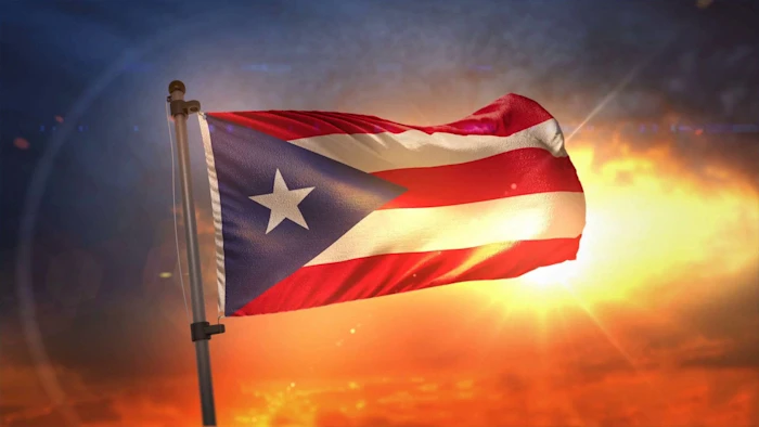 puerto-rican-flag-waving-high-qn07g7csrtv0q11q