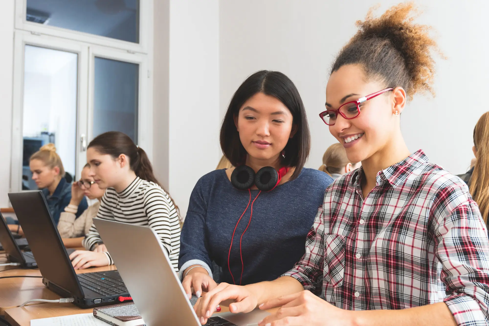 Students in classroom with open laptops