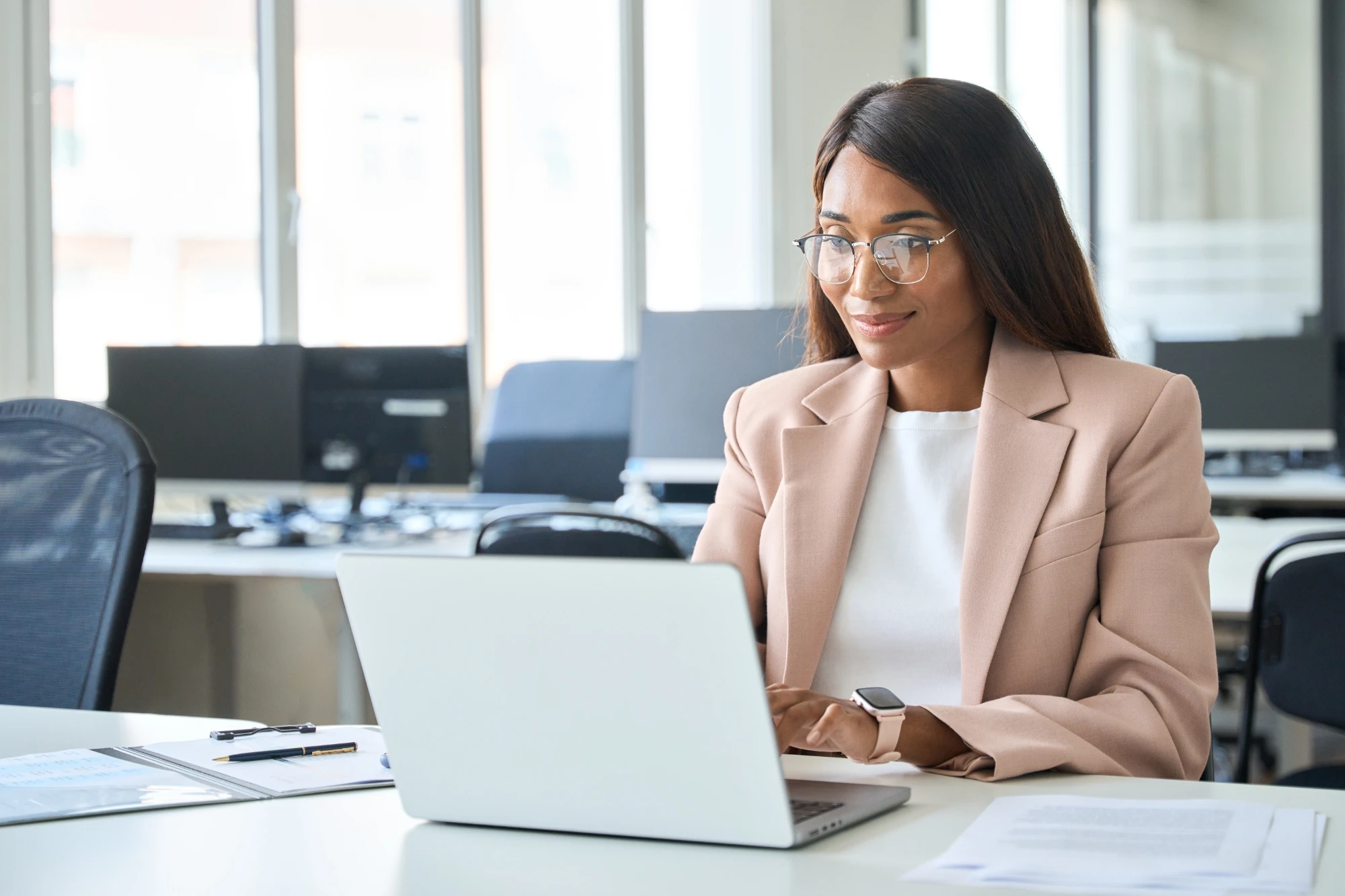 Woman looking at laptop