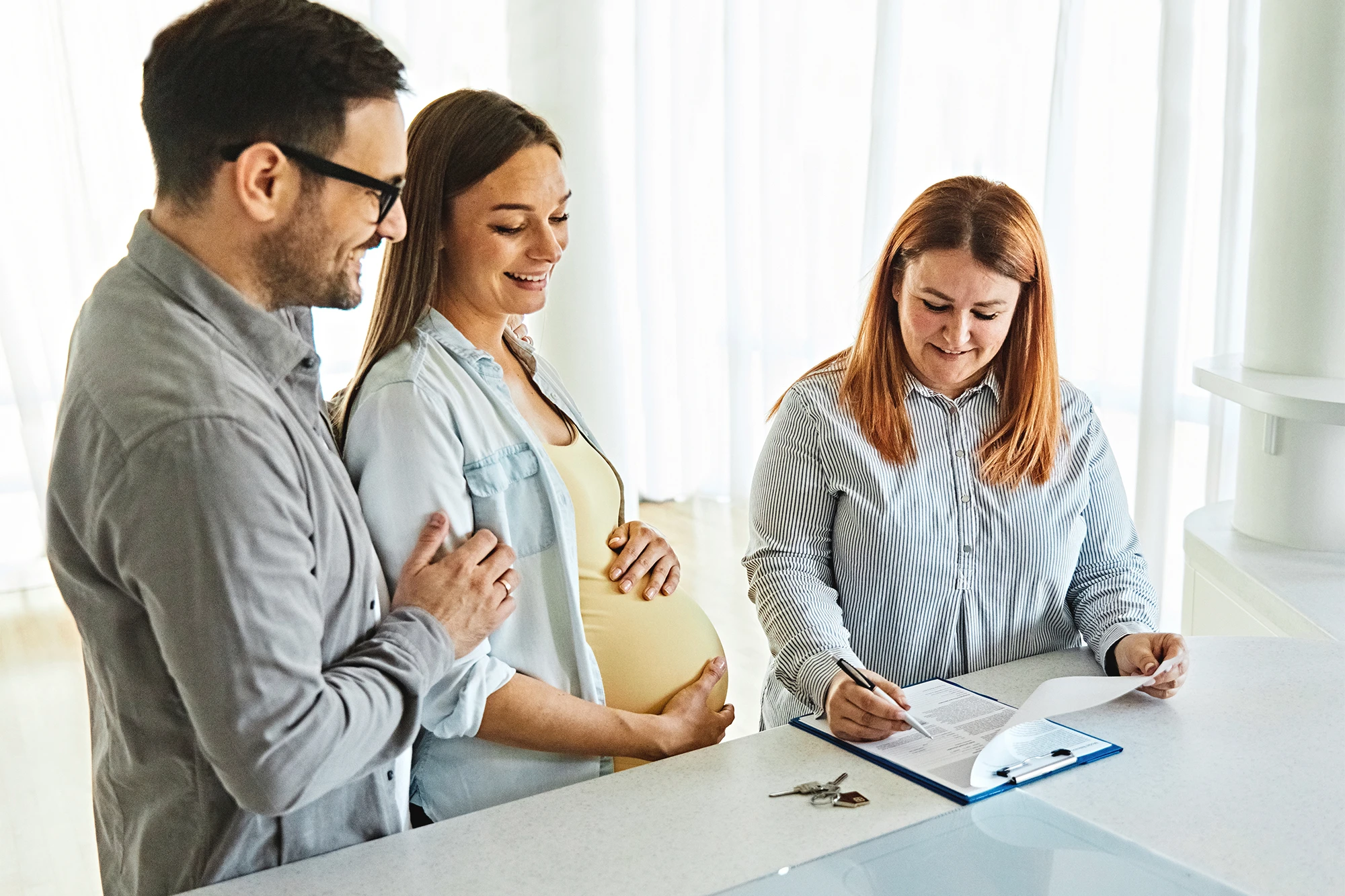 dearborn - pregnant couple with realtor