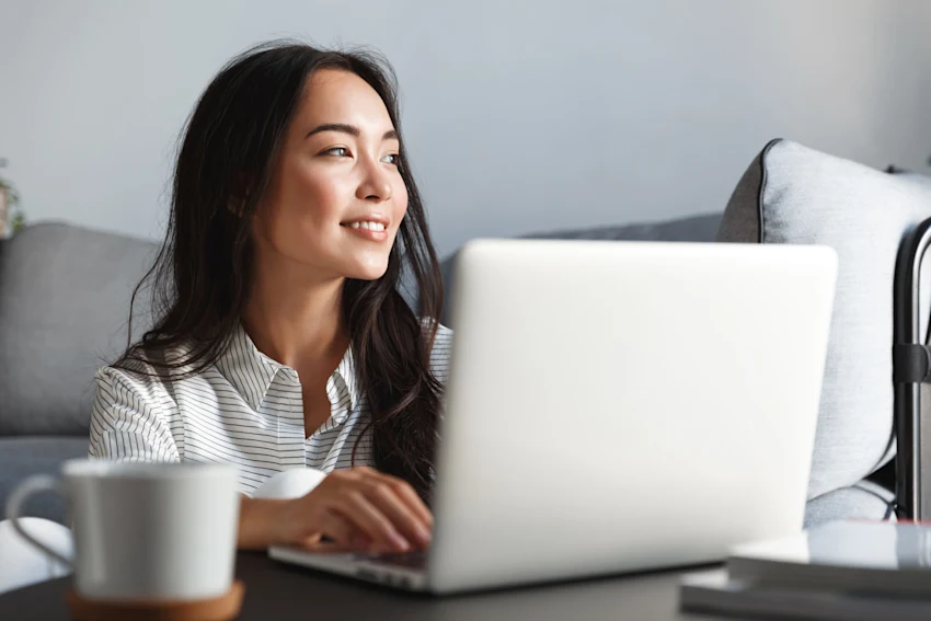 Woman sitting in front of laptop