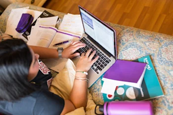 Kaplan-books-laptop