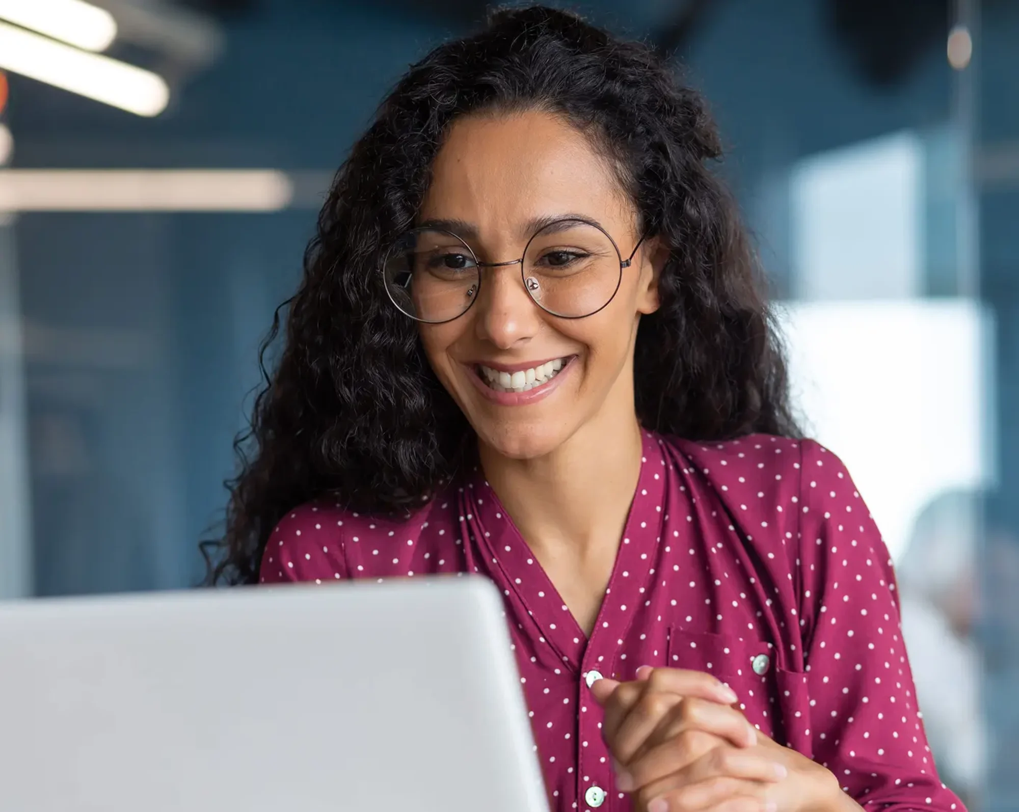 happy hr woman looking at computer screen