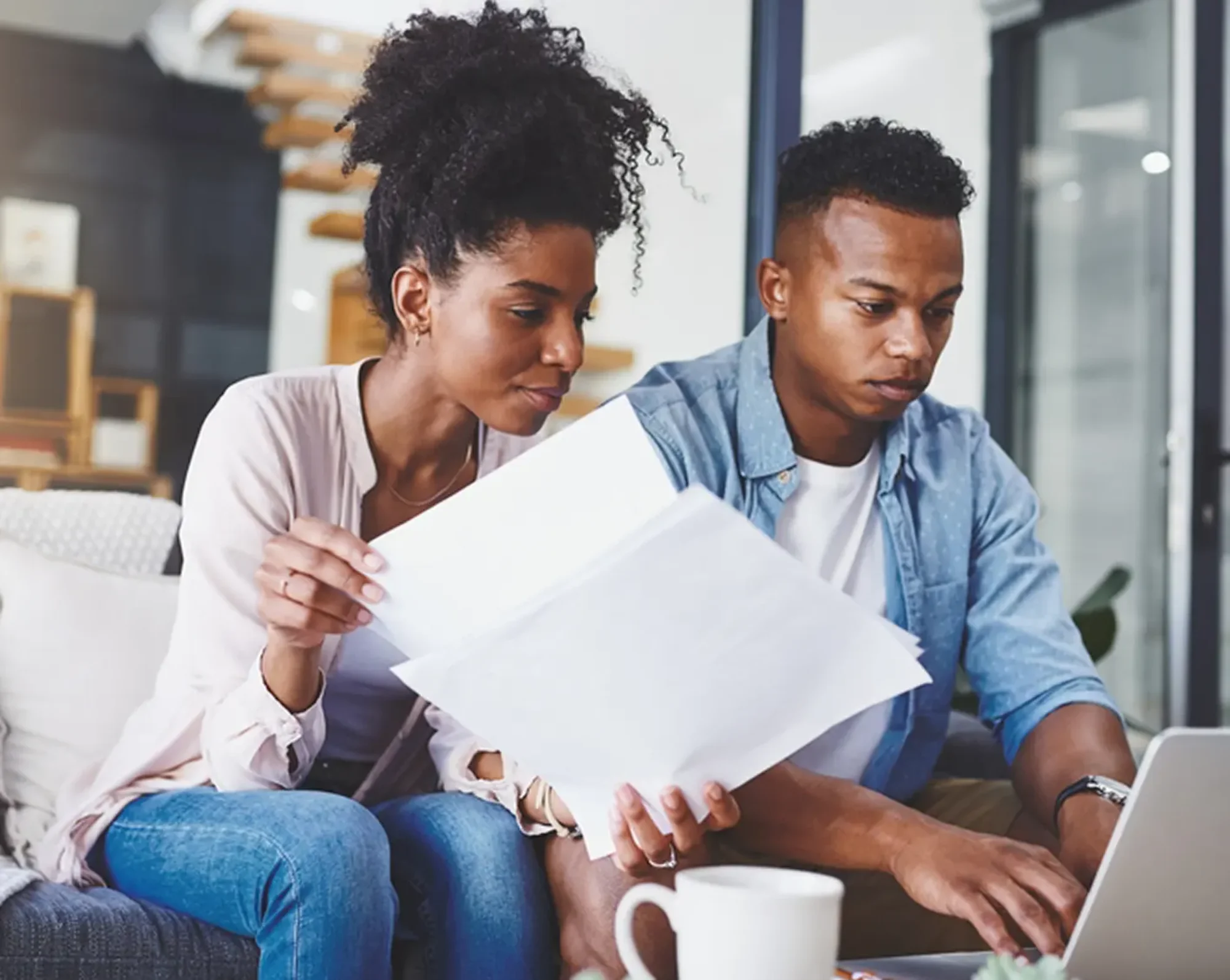 couple looking over retirement plans on computer