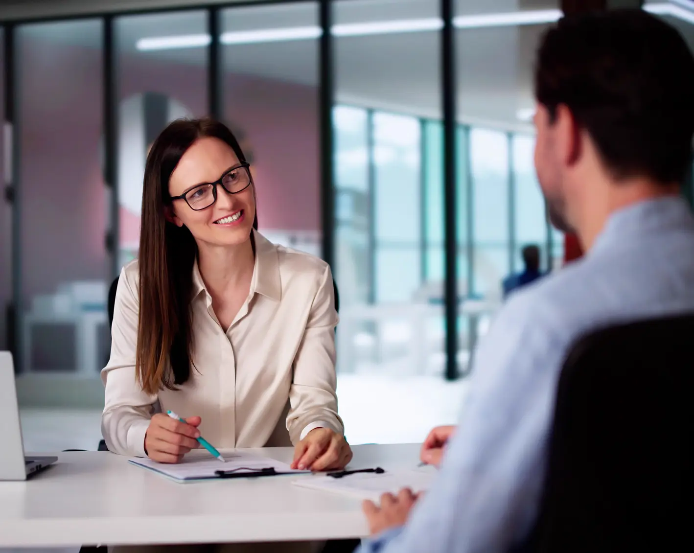 woman interviewing man for job