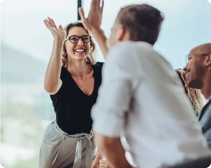 Entrepreneurs giving each other high fives