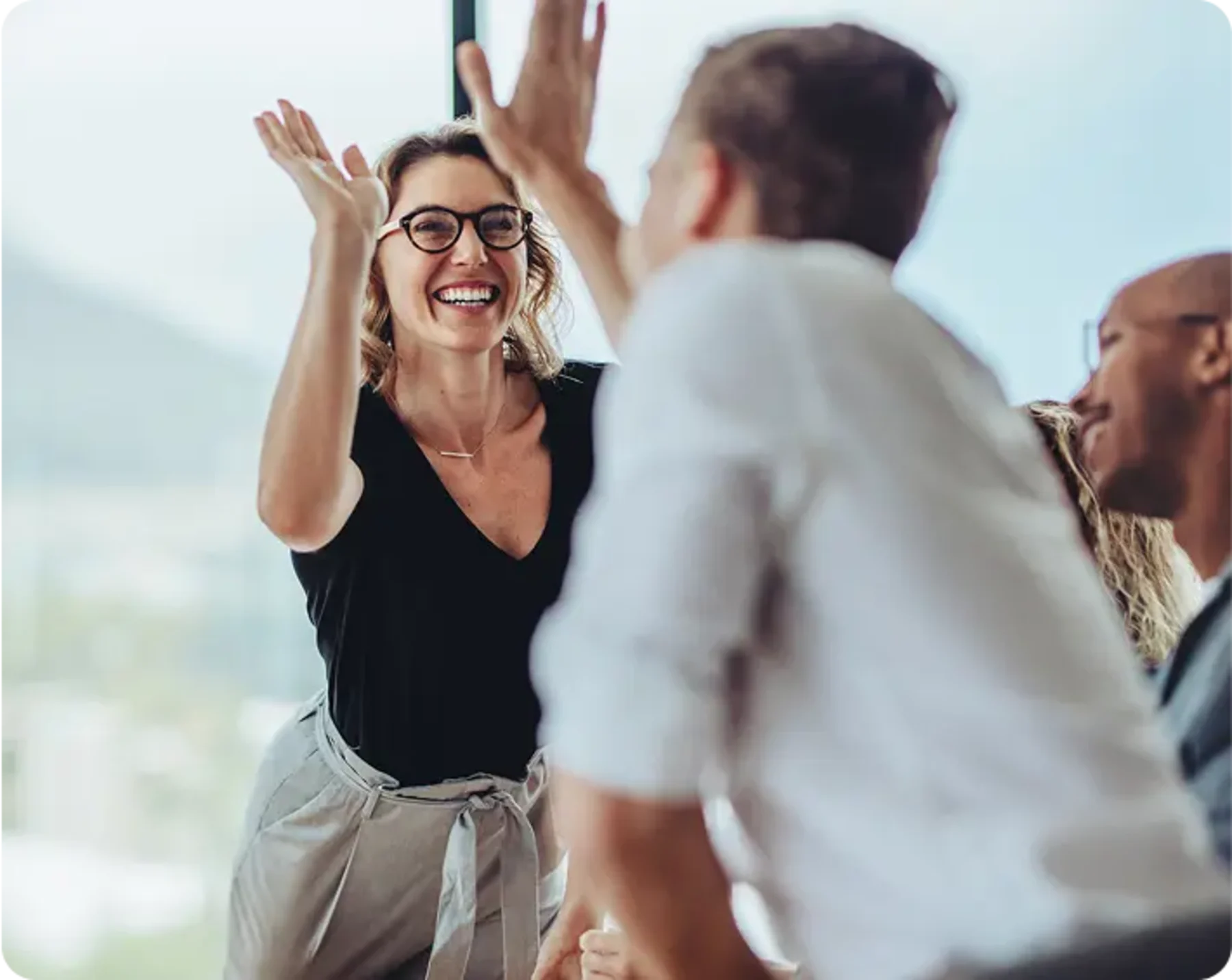 Entrepreneurs giving each other high fives