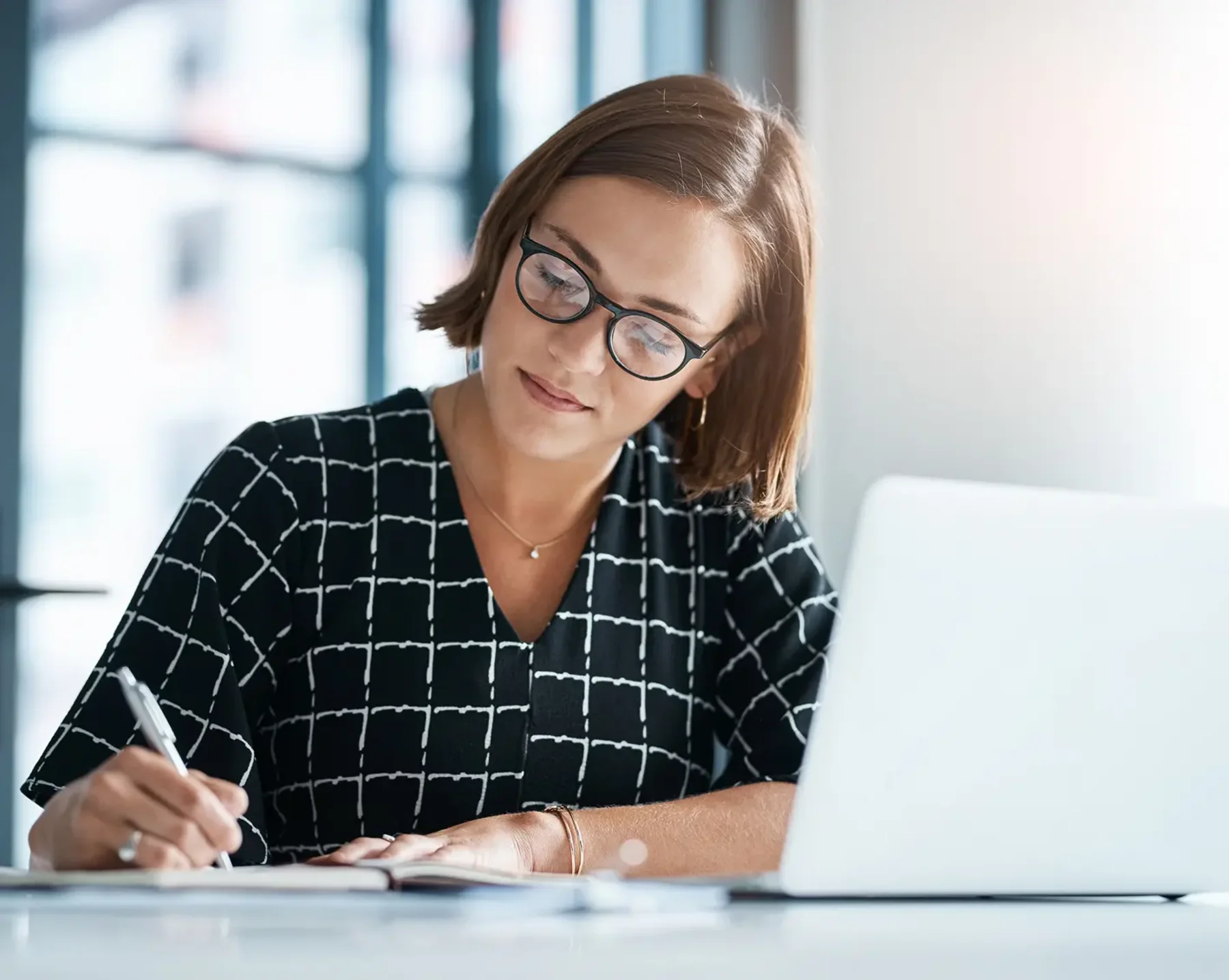 woman making notes about flexible benefits