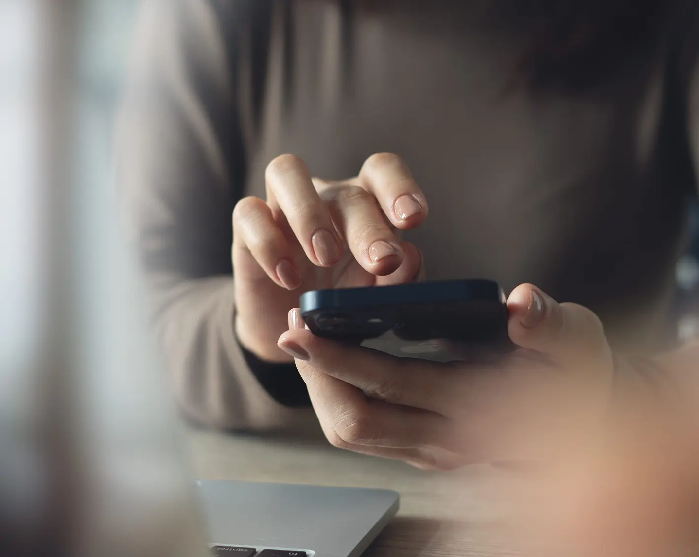 employee looking at financial obligations on phone