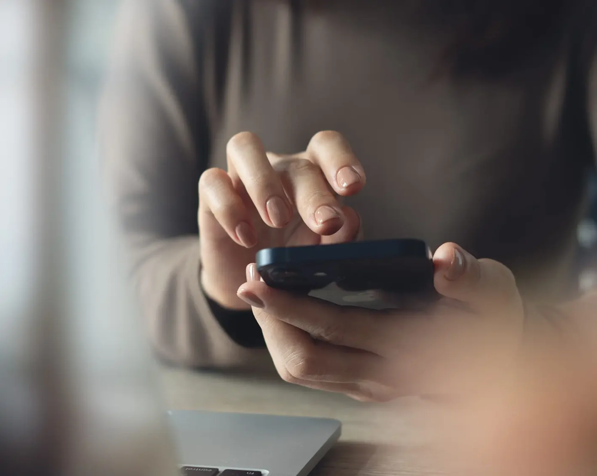 employee looking at financial obligations on phone