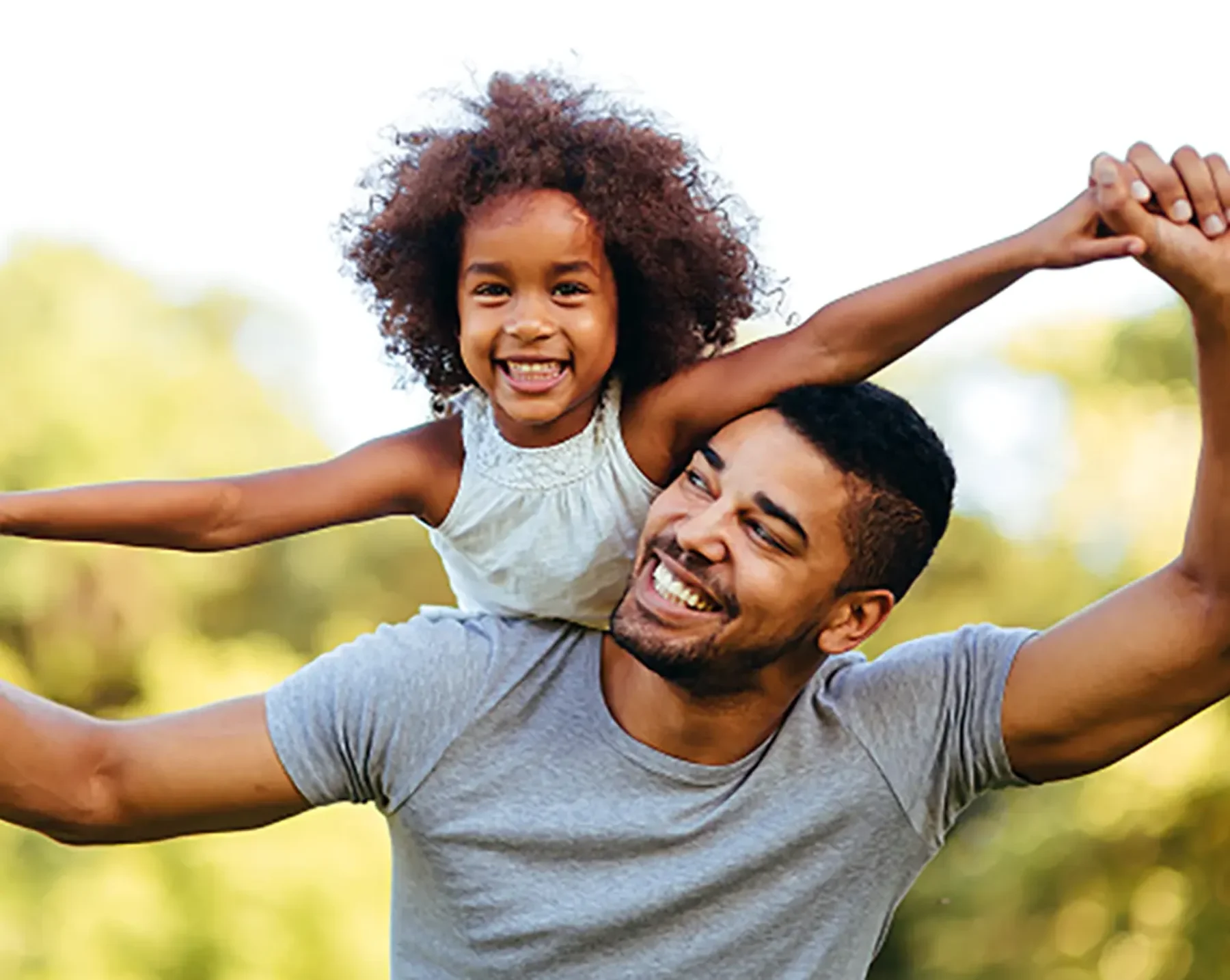 daughter playing at the park with dad