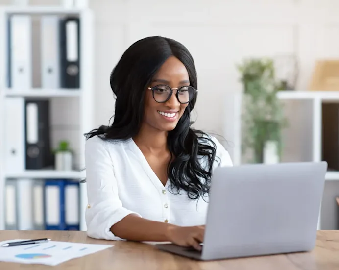Video play icon. woman on computer maximizing productivity