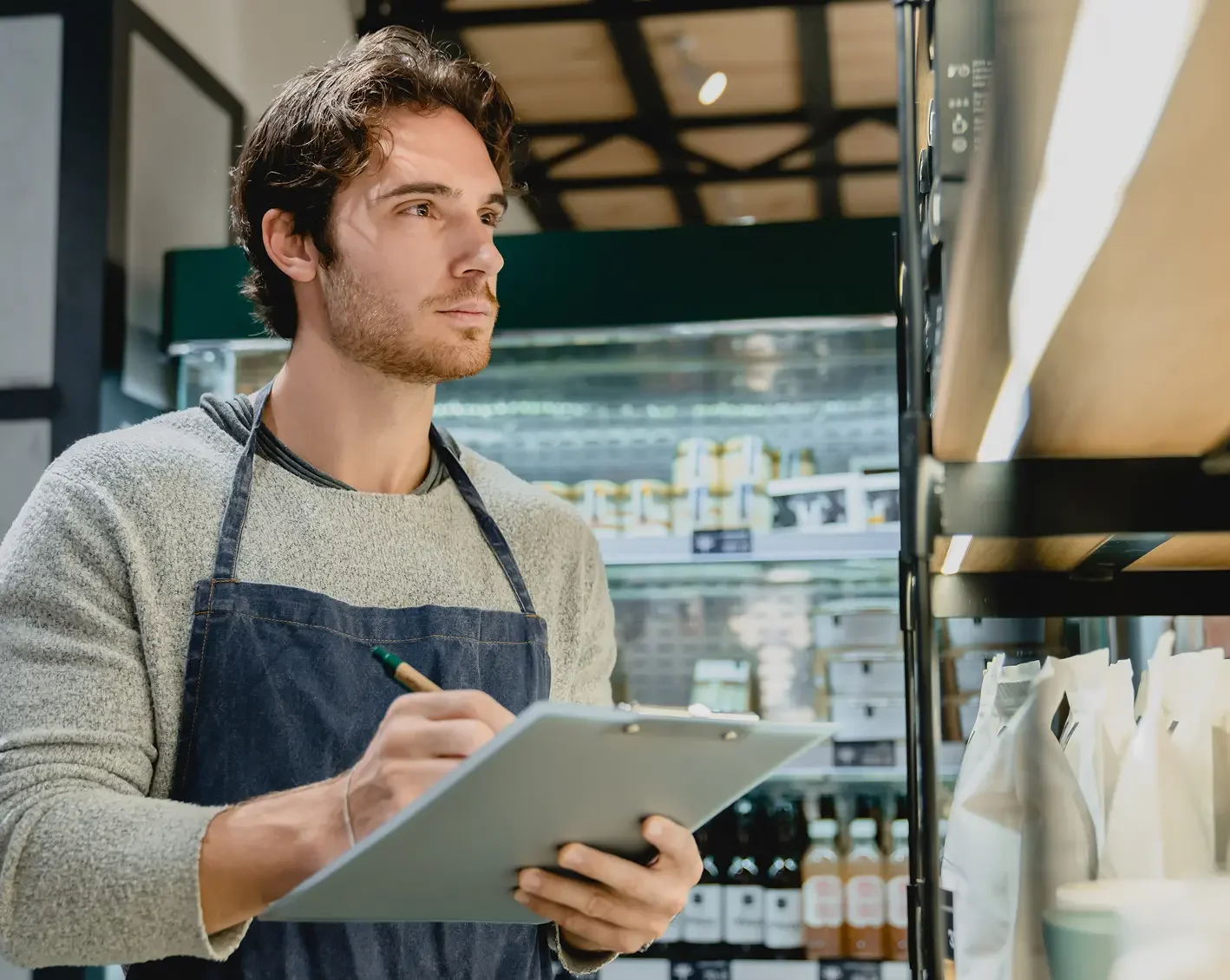 employee taking inventory of franchise stock