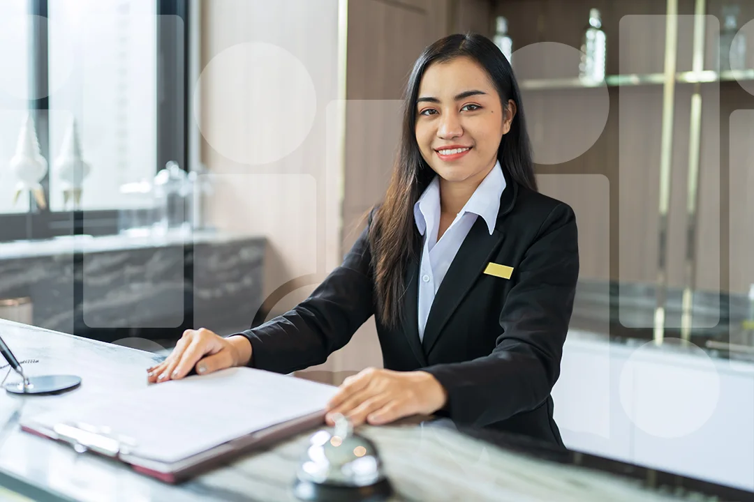 Woman at a hotel front desk