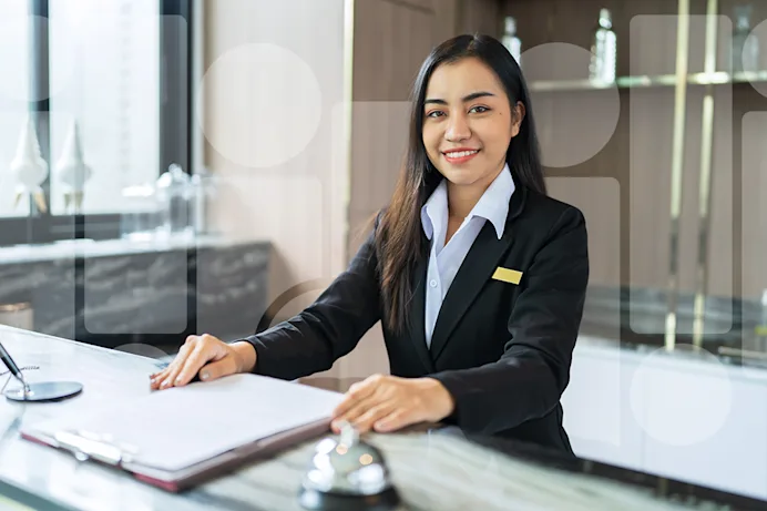 Woman at a hotel front desk