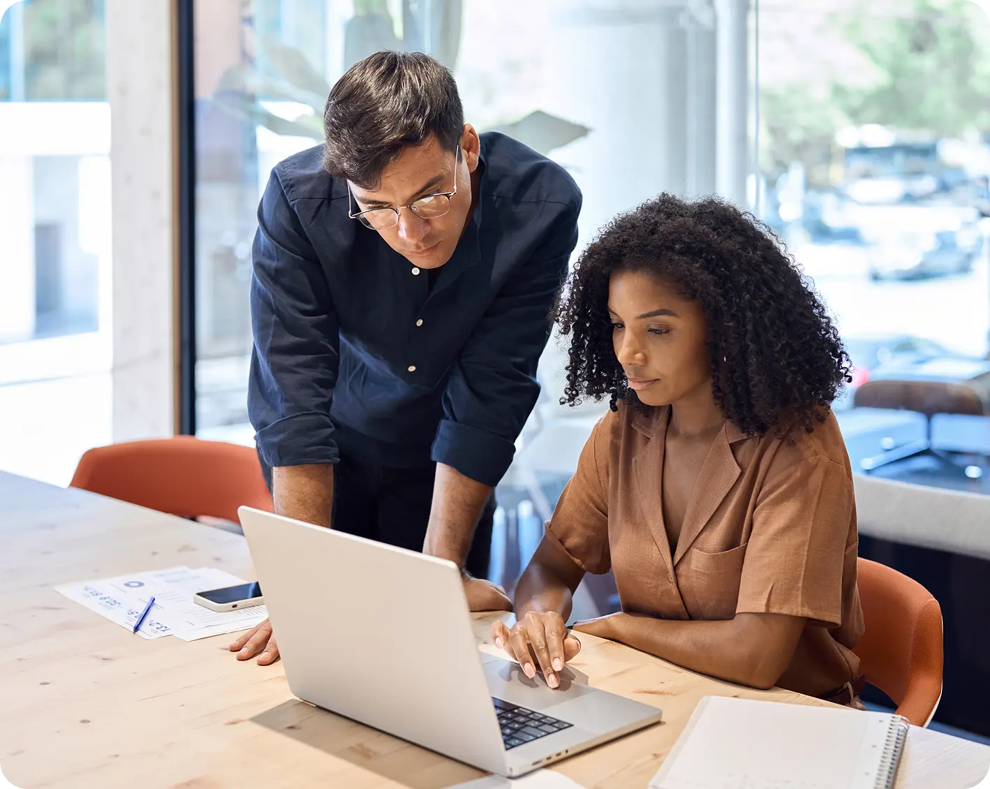 a couple of workers looking over finances