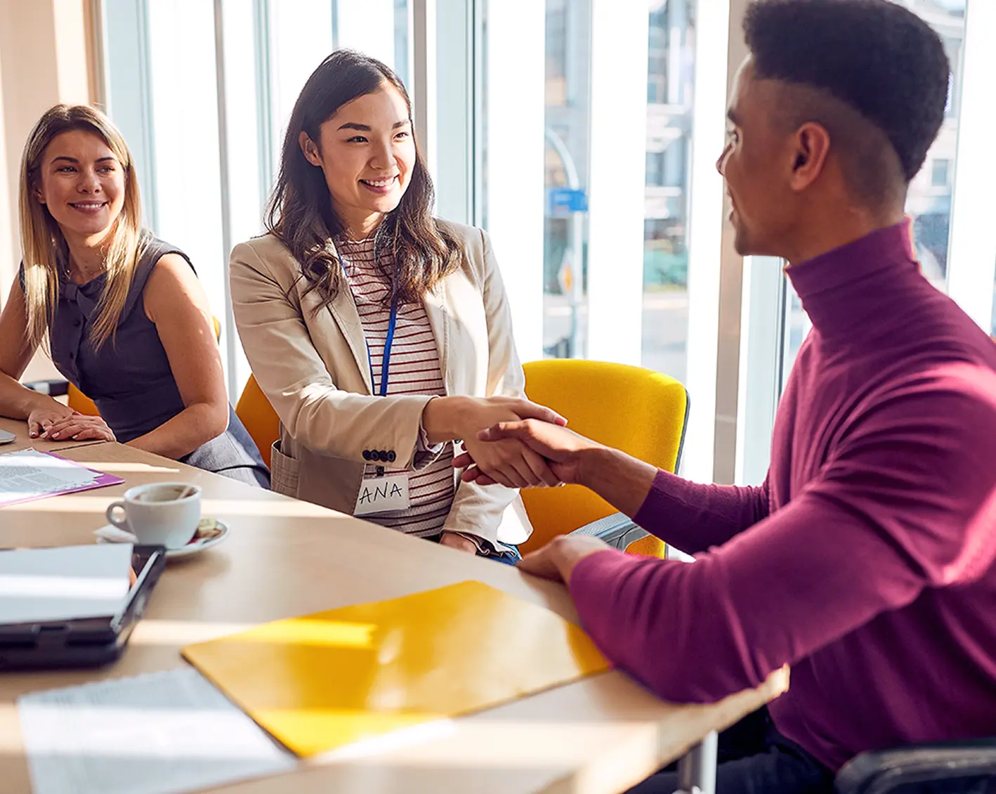 new employee shakes hands accepting job