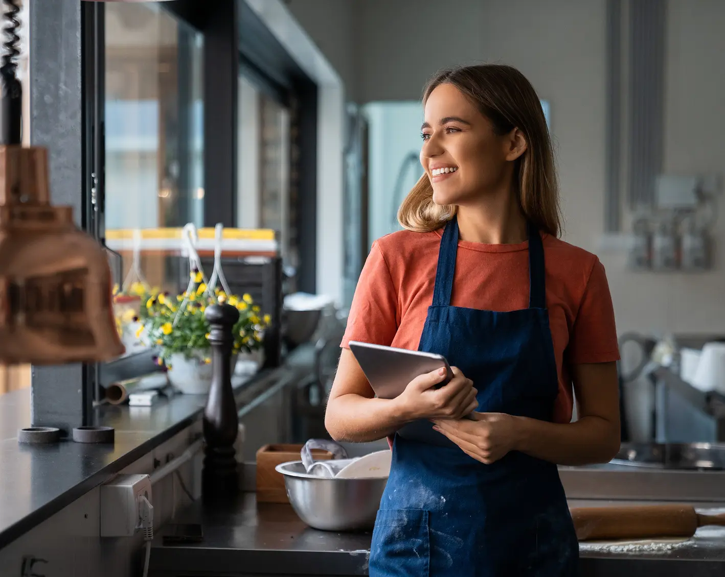 restaurant worker smiling looking out the window