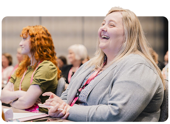 A woman sitting at a conference table