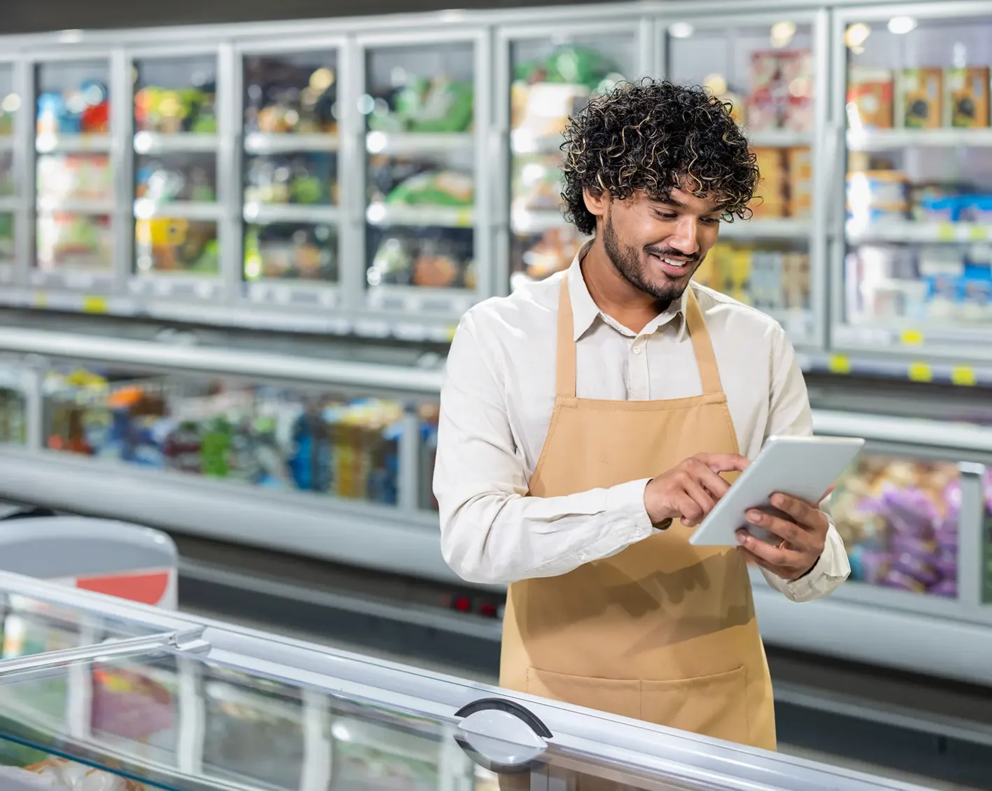 grocery store employee checking produce