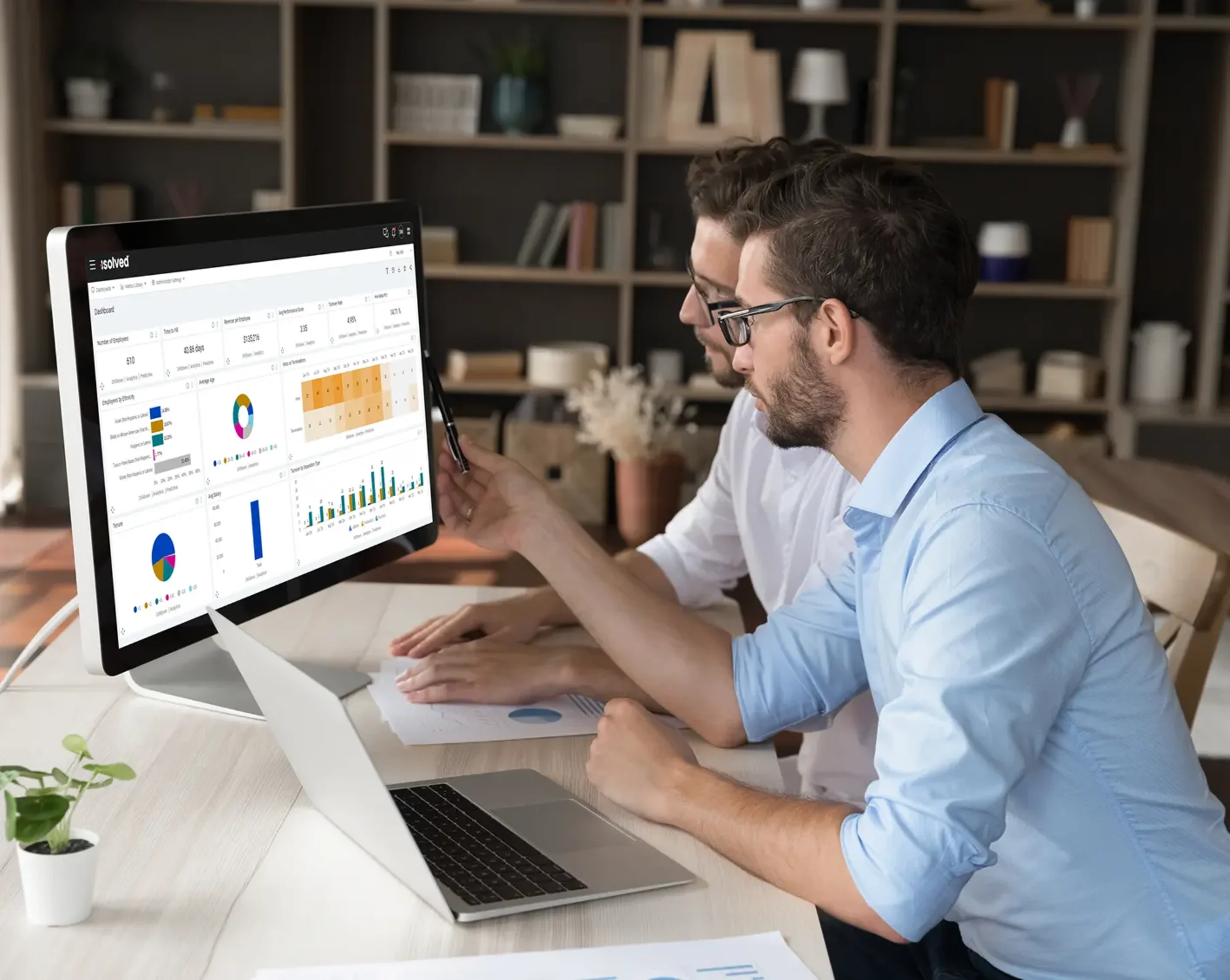 2 coworks looking on computer