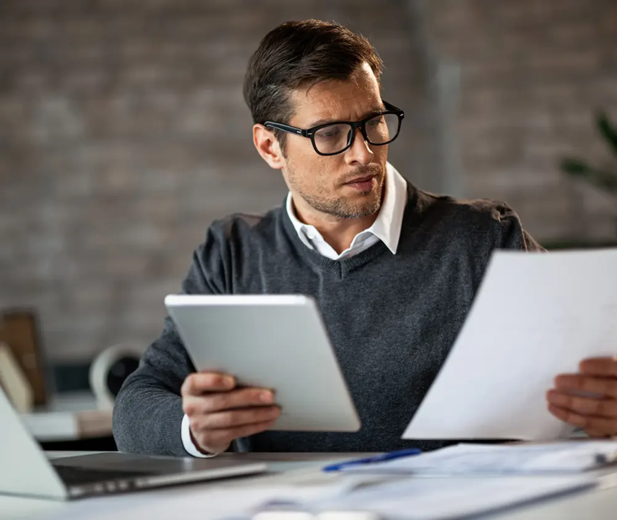 businessman checking through documents for company