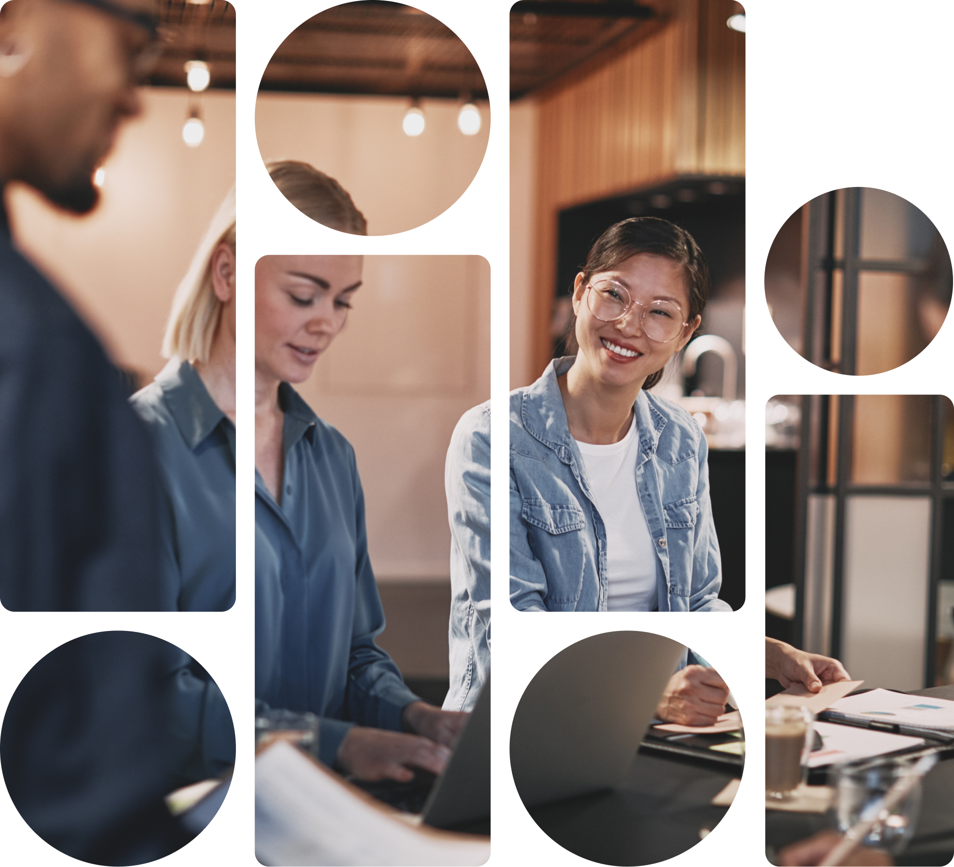 2 women looking over papers and a laptop
