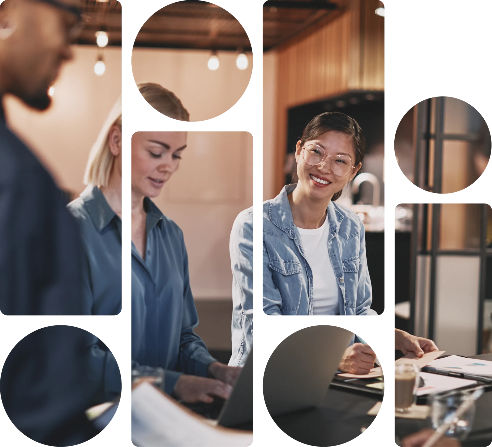 2 women looking over papers and a laptop