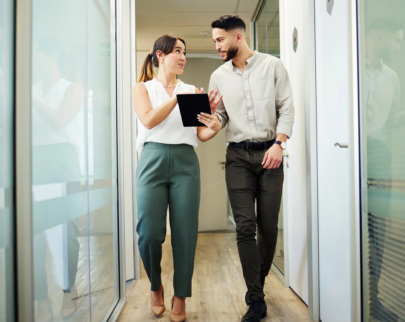 2 employees walking discussing benefits
