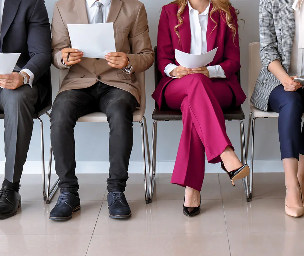 job seekers waiting in line to be interviewed for job