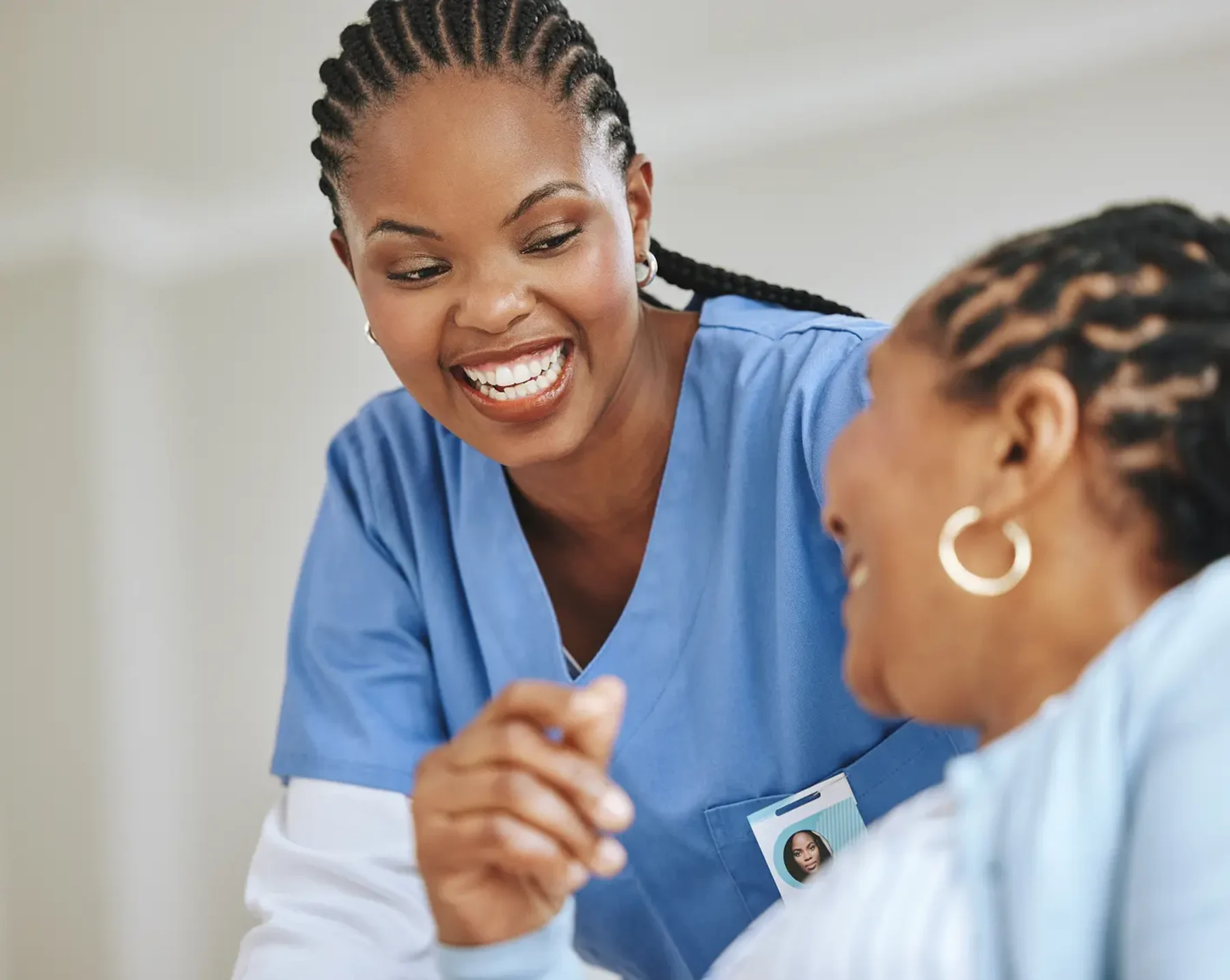 smiling healthcare worker helping a patient