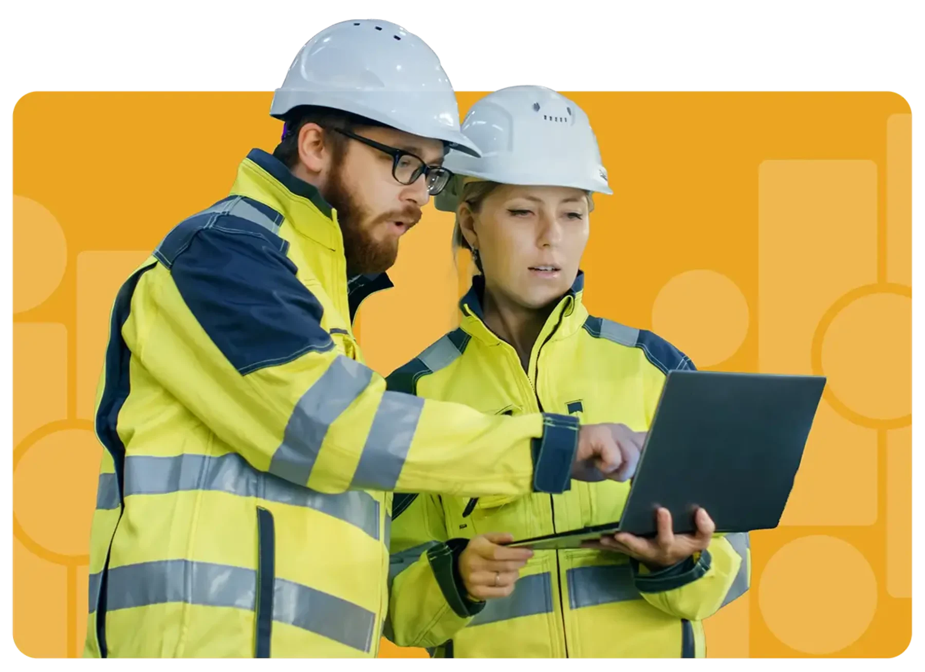 construction workers looking over engineering plans on laptop