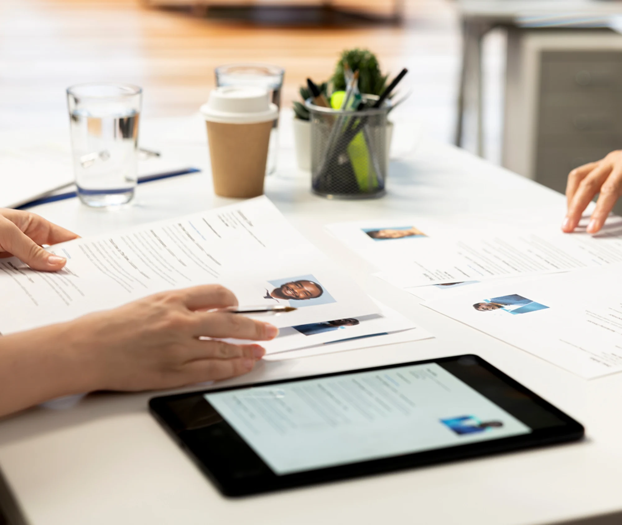 hiring managers looking over job candidates