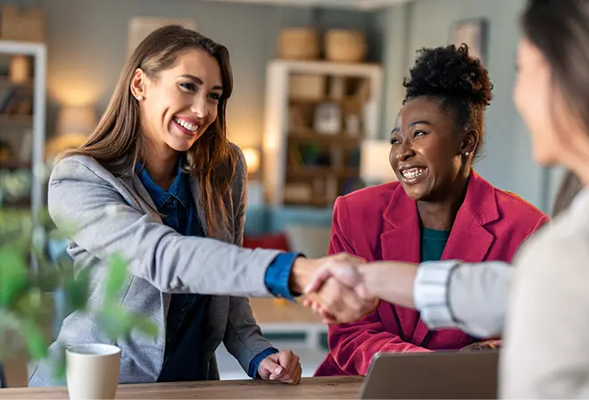 hr shaking hands with job candidate during interview